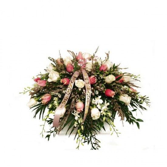 The soft pink casket spray